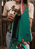 The Howdy Cowhide Clutch in Turquoise