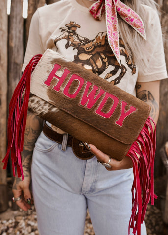 The Howdy Cowhide Clutch in Hot Pink