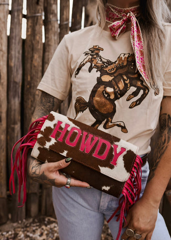 The Howdy Cowhide Clutch in Hot Pink