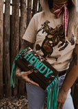 The Howdy Cowhide Clutch in Turquoise