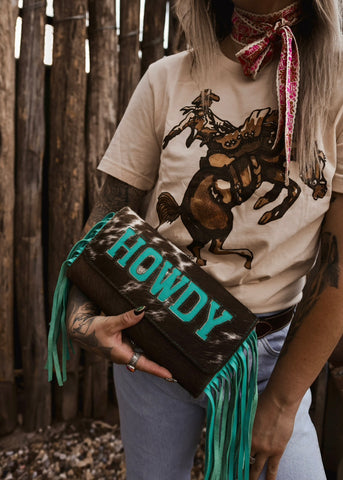 The Howdy Cowhide Clutch in Turquoise