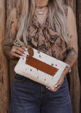 The Westward Cowhide Clutch