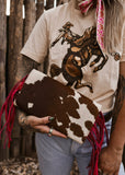 The Howdy Cowhide Clutch in Hot Pink